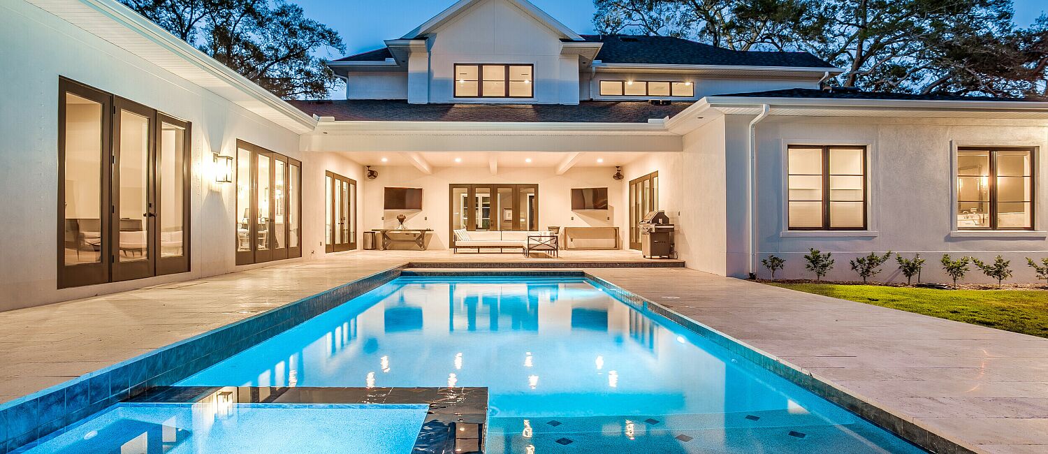Rear view of luxury custom home at twilight in St Petersburg FL