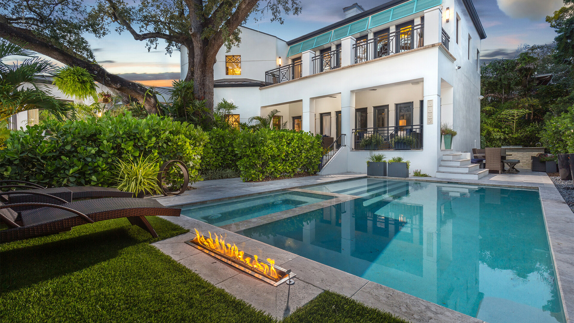 Rear view of luxury modern home boasting an infinity pool, St. Petersburg FL