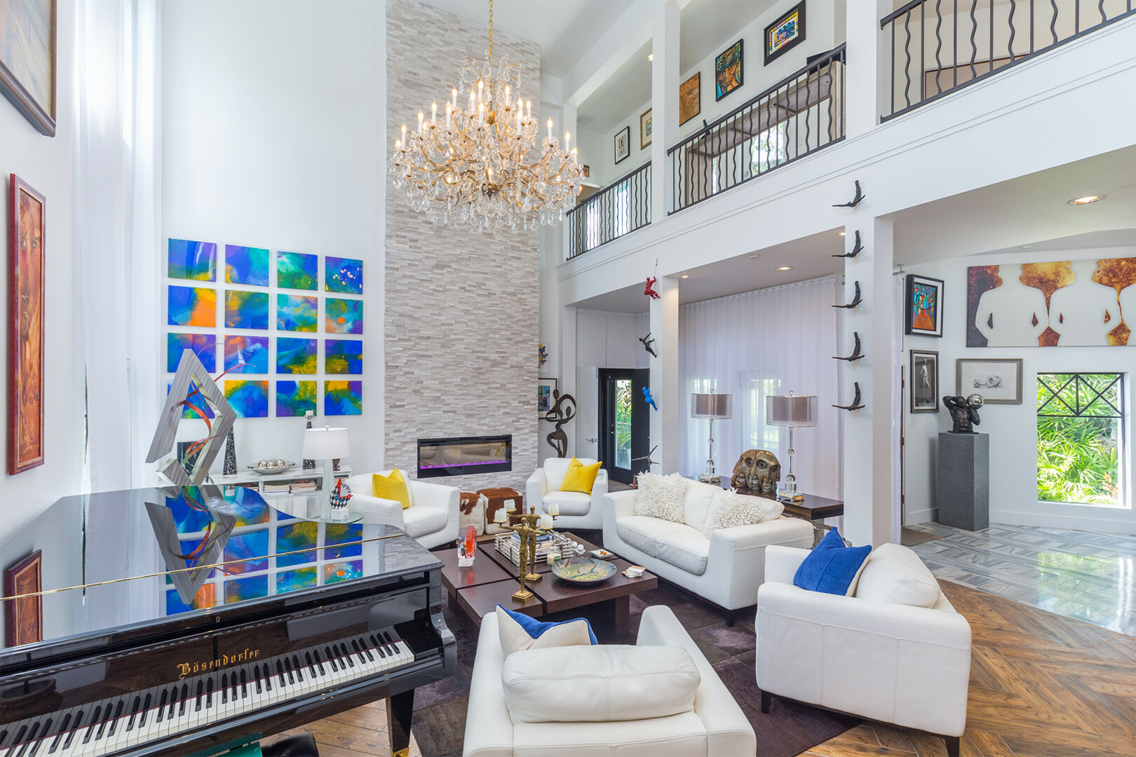 Luxury living room featuring herringbone patterned flooring and a custom fireplace, St. Petersburg FL